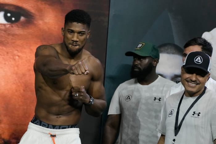 Heavyweight boxer Great Britain’s Anthony Joshua (left) gestures during the weigh-in at King Abdullah Sports City in Jeddah, Saudi Arabia.